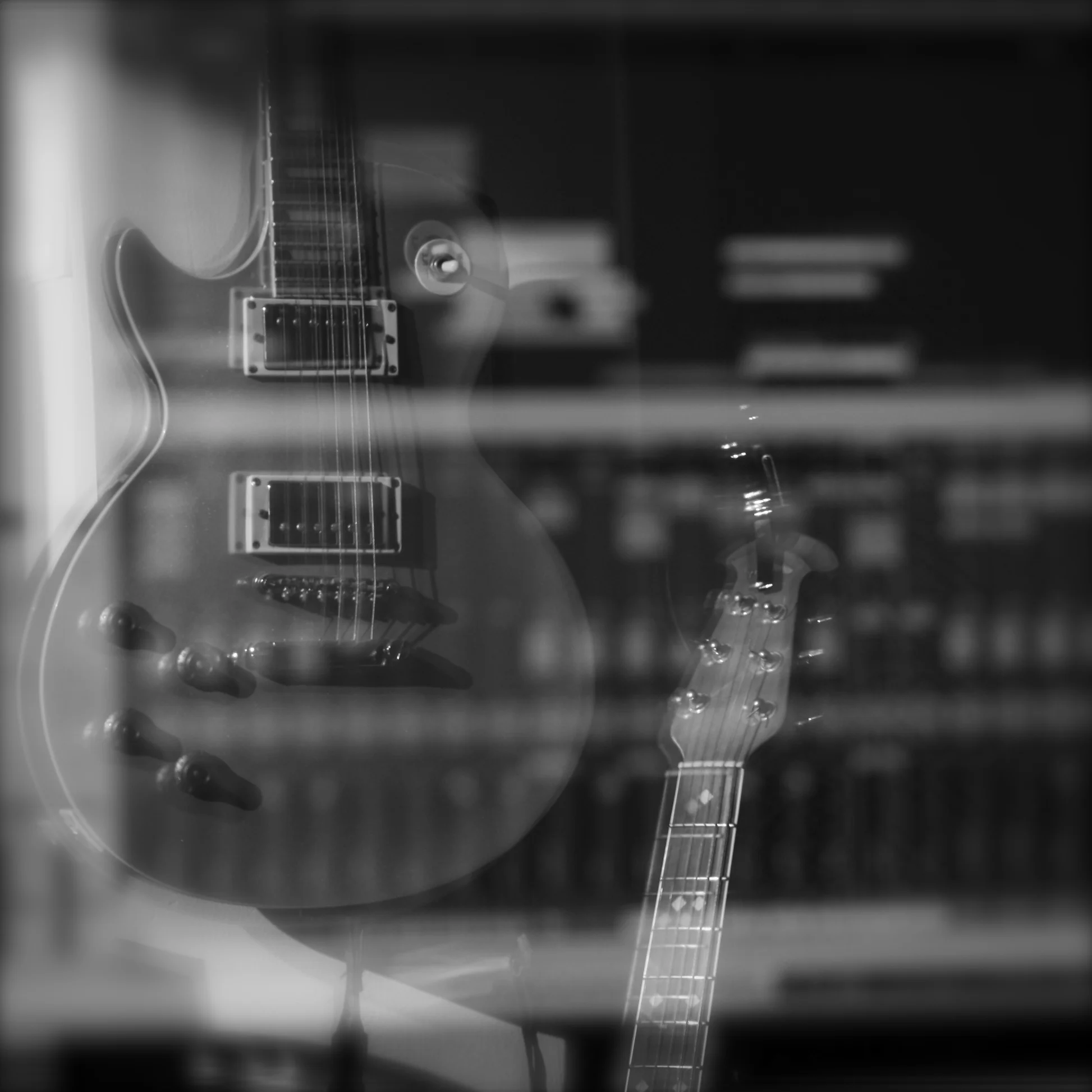 Les Paul guitar and studio screen